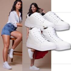 Imagem de Tênis feminino branco + bota esportiva branca: uma dupla dinâmica para