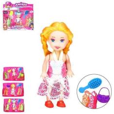 Imagem de Boneca Troca Vestido De Tecido Com Bolsa + Escova 7 Pecas