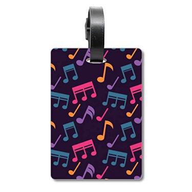 Imagem de Notas musicais coloridas, bolsa de mala preta, etiqueta para cartão de bagagem