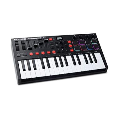 Imagem de M-AUDIO Oxygen Pro Mini - Controlador de Teclado MIDI USB de 32 Teclas Com Pads de Batida, Knobs, Botões e Faders Atribuíveis ao MIDI, e Pacote de Sons Native Instruments (Integração NKS)