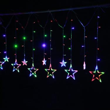Imagem de As decorações de Natal levaram pequenas lanternas estrela de cinco pontas, feriado, luzes de néon de