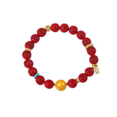 Imagem de Pulseira Cinnabar com miçangas cortadas em lanterna e detalhes em amarelo