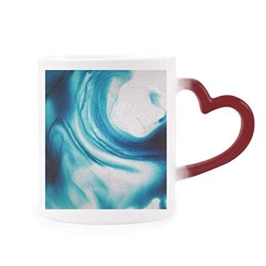 Imagem de Caneca de grés abstrata sensível ao calor transparente com pigmento azul líquido que muda de cor vermelha