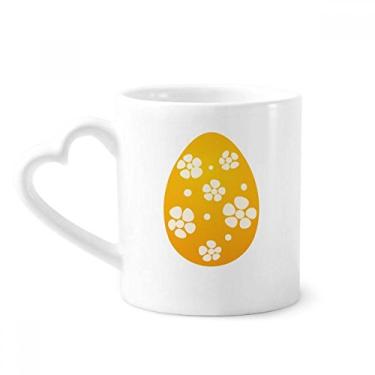 Imagem de Caneca com design de ovo amarelo Festival da Religião da Páscoa Caneca de café cerâmica copo de coração de vidro