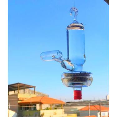 Imagem de Bebedouro e comedouro com poleiro todo em vidro para pássaros ar livre