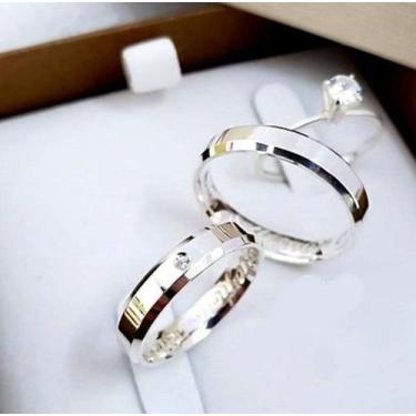 Imagem de Uma aliança de Prata 950 largura 5 mm trabalhada com anel - Ouro 18 ki