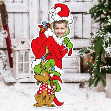 Imagem de Decorações de Natal ao ar livre, placa de quintal de férias com estacas, personagem de desenho animado rosto no orifício, adereços de foto de jardim, gramado, enfeites de topo de árvore de Natal