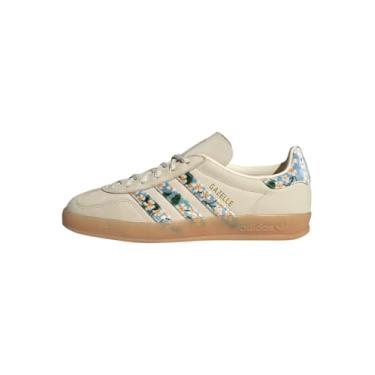 Imagem de adidas Tênis feminino tripulado/dourado/tacblu gazelle para ambientes internos W creme branco dourado met./azul tátil 35 EUA, Multi, 6 Wide