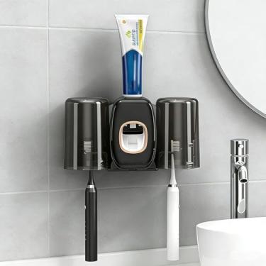 Imagem de Suporte de escova de dentes com dispensador de pasta de dente, espremedor automático de pasta de dente montado na parede, organizador de armazenamento com 2 xícaras sem perfuração para banheiro (preto