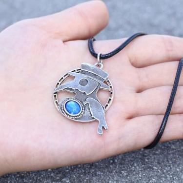 Imagem de 1 chapéu geométrico exclusivo com um design de pica-pau e enfeites de pedras preciosas falsas, com um pingente de prata metálico de estilo vintage. Perfeito para uso diário, encontros, viagens, danças