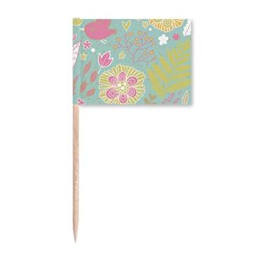 Imagem de Decoração de festa com estampa de folhas verdes e flores, bandeiras de palito de dentes