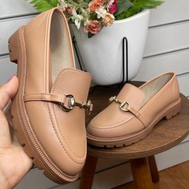 Imagem de mocassim tratorado beira rio