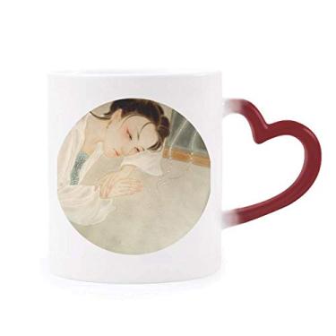 Imagem de Caneca branca chinesa tradicional com pintura de beleza sensível ao calor, copo de grés que muda de cor vermelha