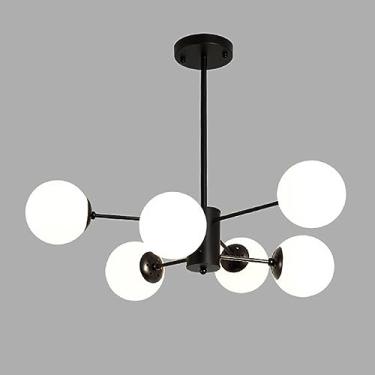 Imagem de Lustre moderno preto com múltiplas lâmpadas e cúpulas de vidro branco, ideal para iluminação de teto em ambientes internos, como quarto, sala de estar, cozinha, ilha ou mesa de jantar.