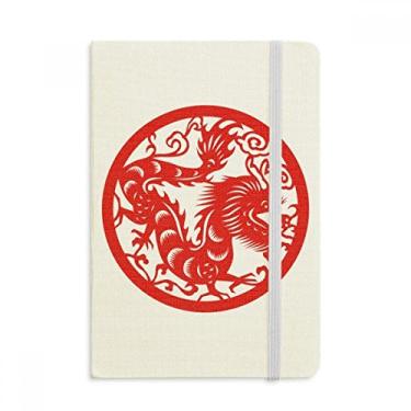 Imagem de Caderno de arte oficial do zodíaco da China com desenho de dragão cortado em papel