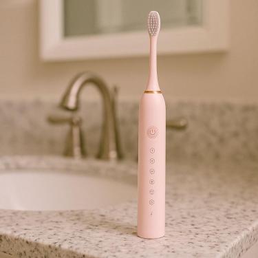 Imagem de Escova Elétrica Dental Com Movimento Giratório