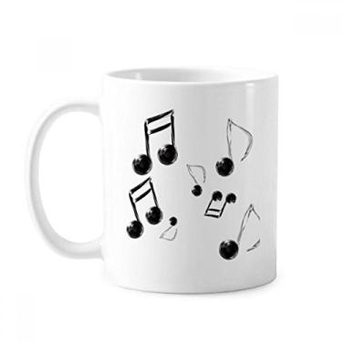 Imagem de Caneca de cerâmica com combinação de bolhas, notação musical, xícara de porcelana e café, utensílios de mesa