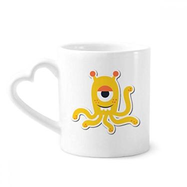 Imagem de Caneca de café cerâmica com monstro amarelo universo e alienígena copo de coração de vidro