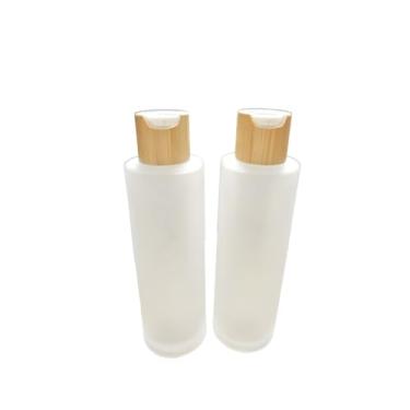 Imagem de Frasco de vidro líquido de essência vazia de 100 ml com prensa de tampa flip de bambu, frasco de óleo essencial recarregável fosco translúcido, frasco de frasco de armazenamento para maquiagem de