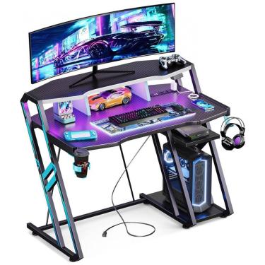Imagem de Mesa Gamer 103 cm MOTPK Preta com Tomadas Elétricas, Luzes LED, Prateleiras Duplas e Textura Fibra de Carbono, Modelo MKB04020201002
