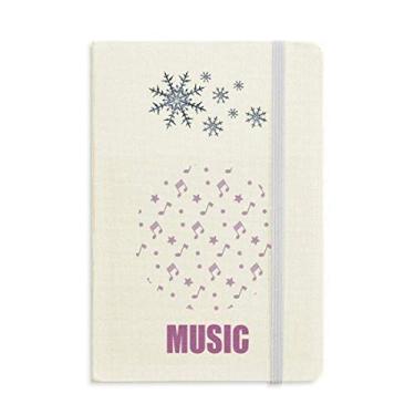 Imagem de Caderno de notas musicais com estrelas pequenas roxas e flocos de neve para inverno