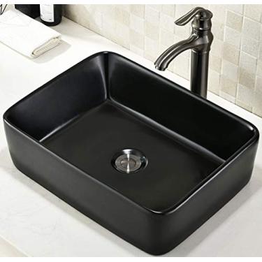 Imagem de Pia de vaso de banheiro fosca preta de 48 cm x 38 cm acima do balcão de pia retangular de porcelana