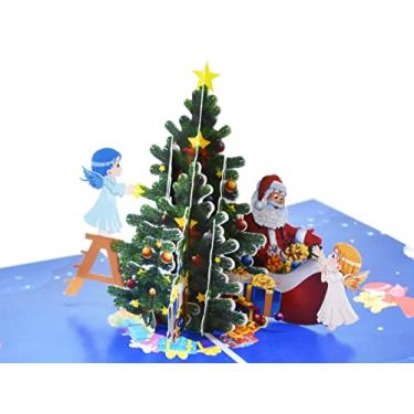 Imagem de Cartão pop-up 3D de Natal com anjos decorando árvore de Natal com Papai Noel