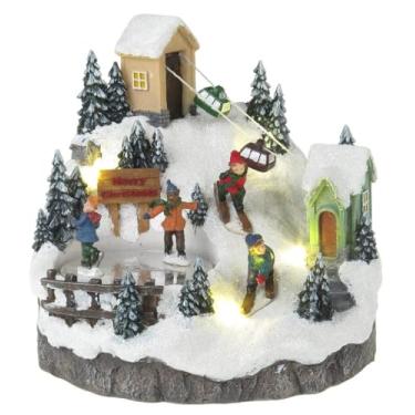 Imagem de Lightahead Cena de estação de esqui de Natal com patinadores girando, luzes LED e 8 melodias. Uma estatueta musical encantadora