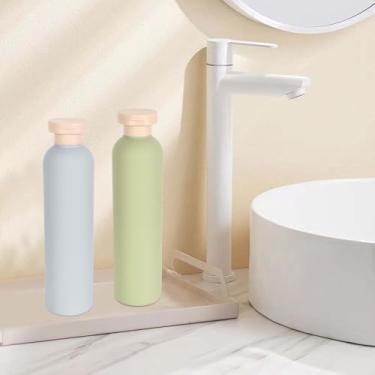 Imagem de Conjunto de 2 frascos de apertar recarregáveis, garrafa de viagem com tampa flip, garrafa dispensadora portátil, garrafa vazia à prova de vazamento para xampu, cremes, loção, banheiro, verde + azul