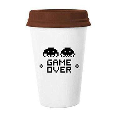 Imagem de Caneca de cerâmica Game Over Little Monster Pixel de vidro bebendo café