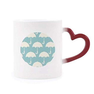 Imagem de Caneca branca com estampa de clima sensível ao calor com estampa de guarda-chuva vermelho que muda de cor