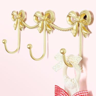 Imagem de KYIAANY Ganchos de laço dourados para meninas: ganchos bonitos de laços triplos suporte de parede para quarto de bebê banheiro para pendurar bolsa de toalha roupão joias - metal 3 ganchos decoração de