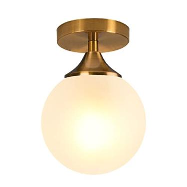 Imagem de Luminária de teto semi-embutida com globo de vidro leitoso pequeno, estilo moderno de meados do século XX, na cor dourada, em latão, ideal para hall de entrada e quarto.