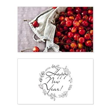 Imagem de Fotografia de cereja, frutas vermelhas, temperadas, festival de ano novo, cartão de felicitações, mensagem de abençoar presente