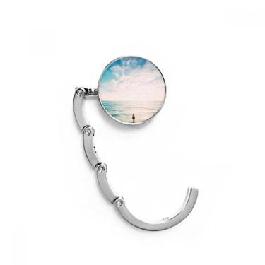 Imagem de Gancho de mesa com gancho decorativo e fecho dobrável com extensão de oceano e praia