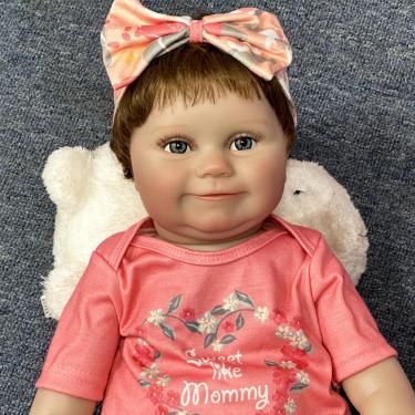 Imagem de SHENGX Bebê Reborn Menina, Bebe Reborn Realista Recem Nascido 50cm/20", Garota De Cabelos Curtos Com AcessóRios De Cabelo E Roupa Rosa, Com Bico De Mamadeira AcessóRios,Corpo De Silicone