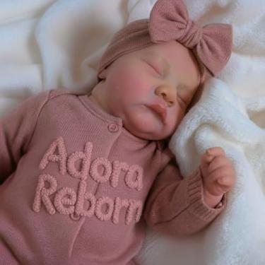 Imagem de Boneca Bebê Reborn Livia Realista em Silicone 46 cm e Pode Dar Banho Acompanha Roupinhas Variadas e Acessórios