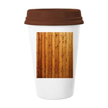 Imagem de Caneca de madeira laranja com textura de papel de parede, copo de cerâmica de vidro para beber café