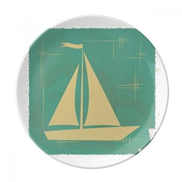 Imagem de Prato decorativo de porcelana com estampa azul e ilustração esportiva de vela para jantar