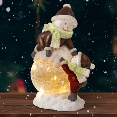 Imagem de caiydramy Lanterna de água de boneco de neve de Natal com luzes LED, estatuetas de globo de neve de resina brilhante, decorações de Natal internas e externas para mesa, gramado, quintal, jardim