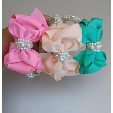 Imagem de Arco de Flores com Pérolas para cabelo. Nas cores: Rosa escuro, Rosa claro e azul.