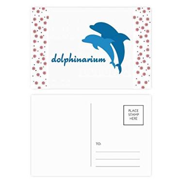 Imagem de Cartão postal de Natal com estampa de golfinho amigável ao oceano azul Natal com estampa de golfinho