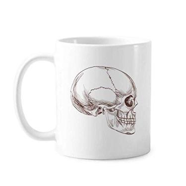 Imagem de Caneca de cerâmica com desenho de perfil de crânio humano, xícara de porcelana de café