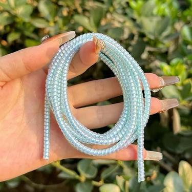 Imagem de Protetor de cabo para reparo de fios à prova de animais, protetor de cabo para animais de estimação, protetor de fone de ouvido, espiral, alívio de tensão, capa para telefone, cabo USB para data