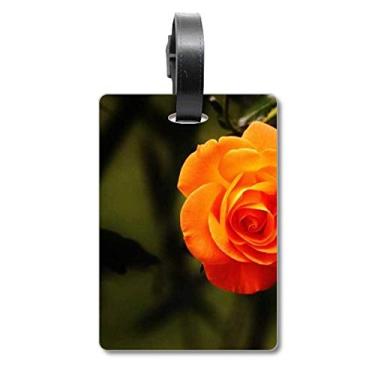 Imagem de Bolsa de mala com estampa de folhas verdes escuras laranja com etiqueta para cartão de bagagem