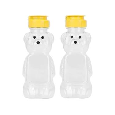 Imagem de YuanHolumid 2 frascos de garrafa de mel de urso de plástico de 227 g, garrafa de espremer de mel vazia com tampa flip-top para armazenamento e distribuição, tampas amarelas para armazenamento e