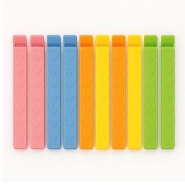 Imagem de Kit com 10 Prendedores para Embalagens – Cores Pastel Reutilizáveis Ideal para Pães Biscoitos Grãos e Mais Fechos plásticos duráveis para manter alimentos sempre frescos e protegidos.