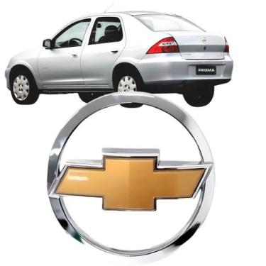 Imagem de Emblema Logo Tampa Traseira Prisma 2006 até 2011 Cromado Gravata Doura