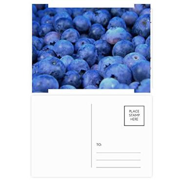 Imagem de Cartão postal de Natal com imagem de frutas tropicais de mirtilo fresco, cartão postal de celebração