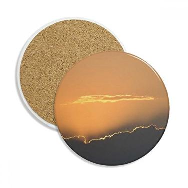 Imagem de Caneca porta-copos laranja céu escuro nuvens copo proteção mesa pedra absorvente